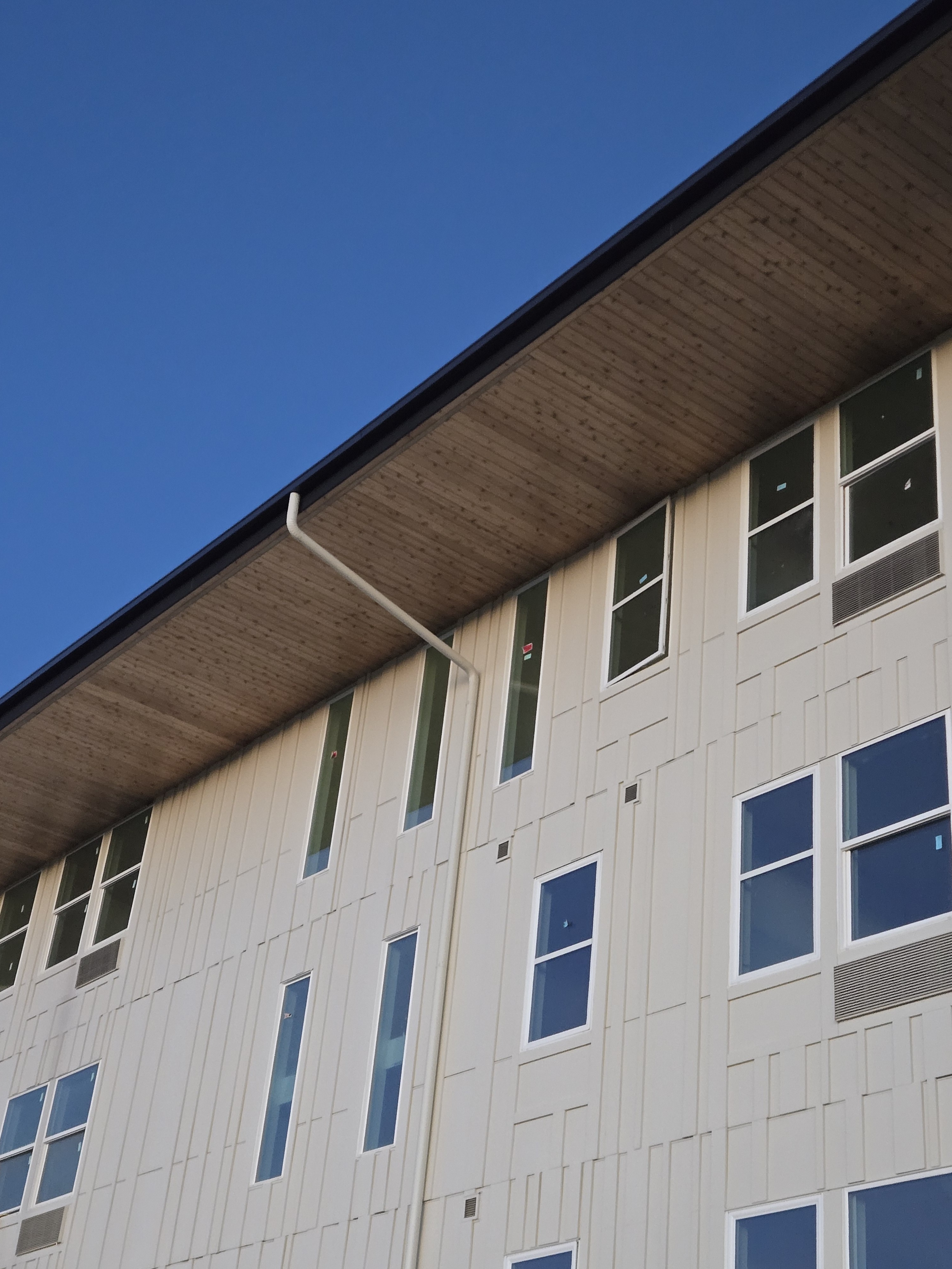 Commercial gutter installation on a multifamily building in Denver