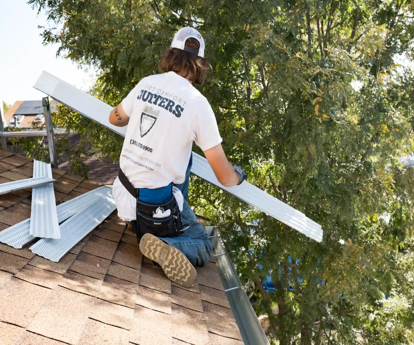 Fort Comfort crew installing gutter guards on a Colorado home